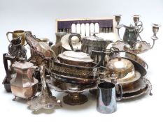 A very large collection of plated jugs, deck bell, pedestal tazza, mahogany cased fish service etc