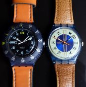 Two Swatch wristwatches Hydrocompass SDN121 and one other, both in Swatch boxes
