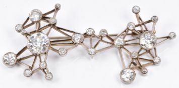 Art Deco/ mid 20thC 18ct white gold pendant/ brooch of angular framework design, set with 25