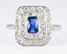 Art Deco platinum ring set with an oval cut sapphire surrounded by two tiers of diamonds, 3.2g, size
