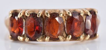 A 9ct gold ring set with five oval garnets, 2.8g, size R