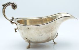 George VI hallmarked silver sauce boat raised on three feet, Birmingham 1939 maker Deakin &