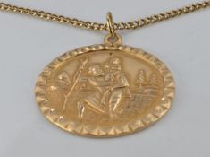 A 9ct gold St Christopher on a 9ct gold chain, 7.9g