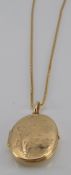 A 9ct locket and chain, 10.4g