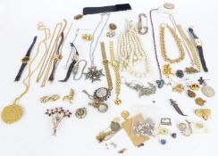 A collection of costume jewellery including Trifari necklace, silver identity bracelet, silver