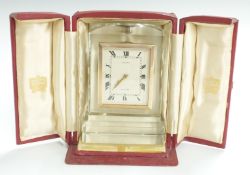 Cartier crystal cased clock with Roman ivory coloured dial, the eight hour keyless movement