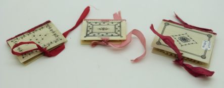 Three 19thC Indian Madras ware ivory needle cases in the form of books, largest 5.5 x 4.5cm