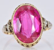 A 14k gold ring set with an oval synthetic ruby, 3.5g, size P/Q