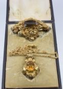 Victorian brooch set with a citrine within a filigree border (W- 3.5cm x L- 5cm), and a similar