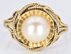 An 18ct gold ring set with a pearl, 4.3g, size M/N