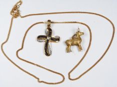 A 9ct gold necklace with stylised cross pendant set with sapphires and diamonds and a 9ct gold