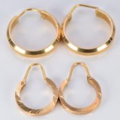 A pair of 18ct gold hoop earrings (4.2g) and a yellow metal pair (2.2g)