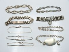 Nine silver bracelets including curb link, gate etc, 130g