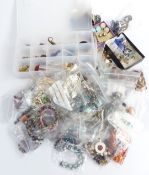 A collection of costume jewellery including faux pearls, glass pendants, silver chain, silver