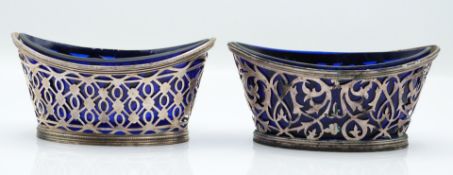 Pair of Victorian hallmarked silver open salts with pierced decoration and blue glass liners, London