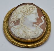 Victorian pinchbeck brooch set with a large cameo depicting Eros, 5.8 x 6.5cm