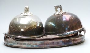 Two large silver plated galleried trays, largest 60 x 42cm and two food covers with ornate