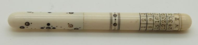 A 19thC turned ivory Indian Madras ware needle cases with engraved calendar decoration, length 9cm