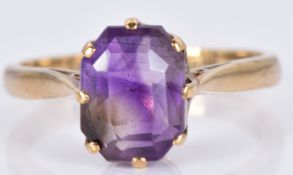 A 9ct gold ring set with an emerald cut amethyst, 2.6g, size K/L