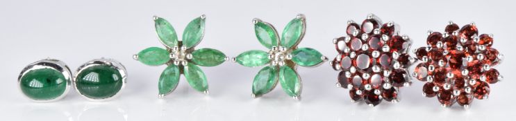 Three pairs of earrings set with garnets and emeralds