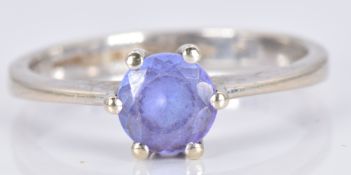 An 18ct white gold ring set with a round cut tanzanite, 3.1g, size M