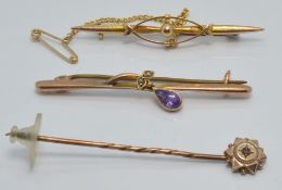 A 9ct gold brooch set with an amethyst, a 9ct gold brooch and a 9ct gold stick pin, 4.5g