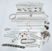 A silver heart shaped pendant set with diamonds, silver chains, silver pendants, silver cufflinks