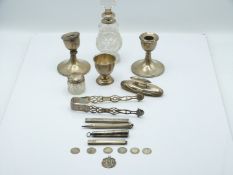 Hallmarked silver items to include Georgian sugar tongs, cigarette holder in case, three pencils and