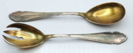 Pair of German white metal salad servers with gilt bowls, stamped 800, length 21cm, weight 159g