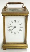 Brass carriage clock with Roman enamelled dial, corniche corners to case and movement stamped '