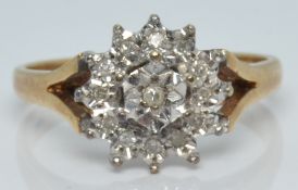 A 9ct gold ring set with diamonds in a cluster, 3.3g, size P