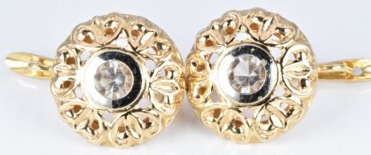 A pair of 18ct gold earrings set with paste, 6.3g