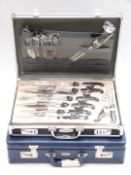 Berghaus stainless steel cutlery set in briefcase type case together with a similarly cased knife