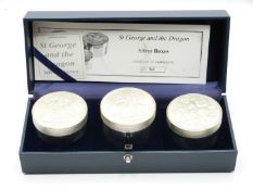 Cased set of three graduated Royal Mint limited edtition (82/500) hallmarked silver St. George and