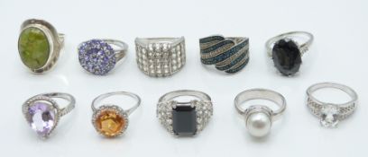 Ten silver rings set with peridot, amethyst, quartz, spihel, itinga petalite, topaz, blue diamond,