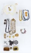 A collection of costume jewellery including vintage Scottie dog with swivelling head, bone and brass