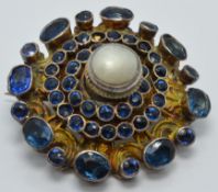 Austro-Hungarian silver gilt brooch set with a pearl and foiled gemstones, diameter 2.5cm