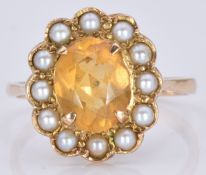 A 9ct gold ring set with an oval cut citrine surrounded by pearls, 4.2g, size R
