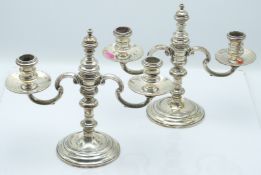 Pair of George VI hallmarked silver candelabra with removable central finials and knopped stems,