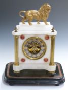 French 19thC mantel clock in onyx case supported by gilt brass reeded columns, surmounted by