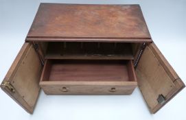 A 19th or early 20thC tile inset oak table top stationery cabinet with fitted interior and single