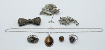 A silver necklace and earrings set with tiger's eye, silver brooch, marcasite, etc. 53.7g.