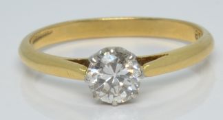 An 18ct gold ring set with a round cut diamond of approximately 0.4ct, 2.1g, size L