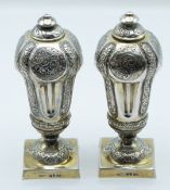 Pair of Victorian hallmarked silver gilt urns or peppers, London 1880, maker Robert Harper, height