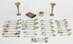 Collection of hallmarked silver and white metal items including napkin ring, pair of vases, ornate