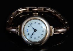 Swiss 9ct gold ladies wristwatch with blued hands, black Arabic numerals, gilt minute markers, white