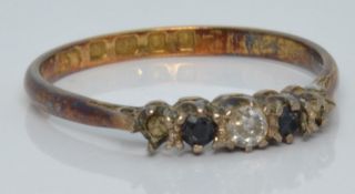 An 18ct gold ring set with a diamond and two sapphires, London 1864, 1.5g, size L/M