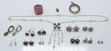 A collection of silver jewellery including a pearl and amethyst necklace, ring, earrings, pendant