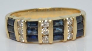 A 14k gold ring set with baguette cut sapphires and round cut diamonds, 4.3g, size N