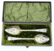A cased pair of Georgian hallmarked silver berry spoons, Exeter 1818 maker Joseph Hicks, length